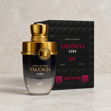 Valencia Uomo black and gold perfume bottle in front of its matching black box on pale stone.